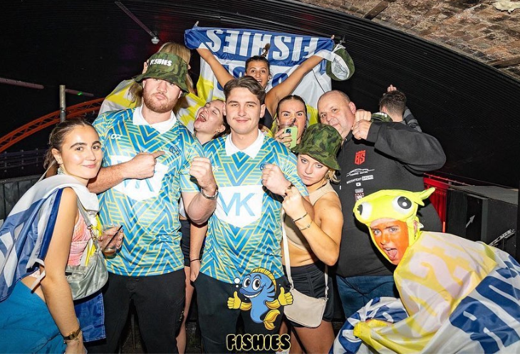 Group of students wearing branded merchandise for Fishies Events